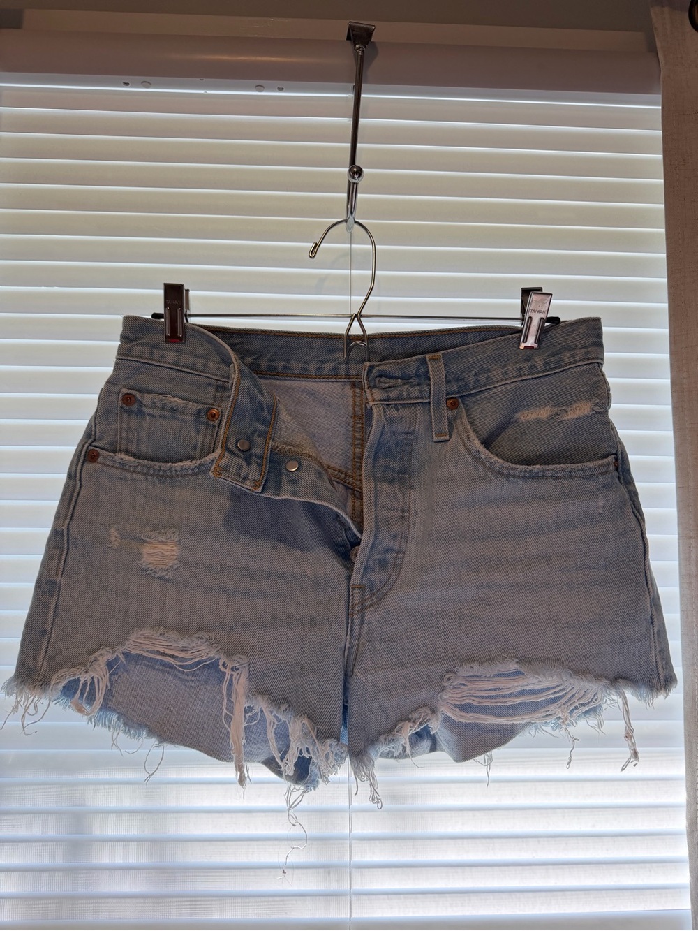 Levi’s High-Rise Distressed Light Blue Denim Shorts